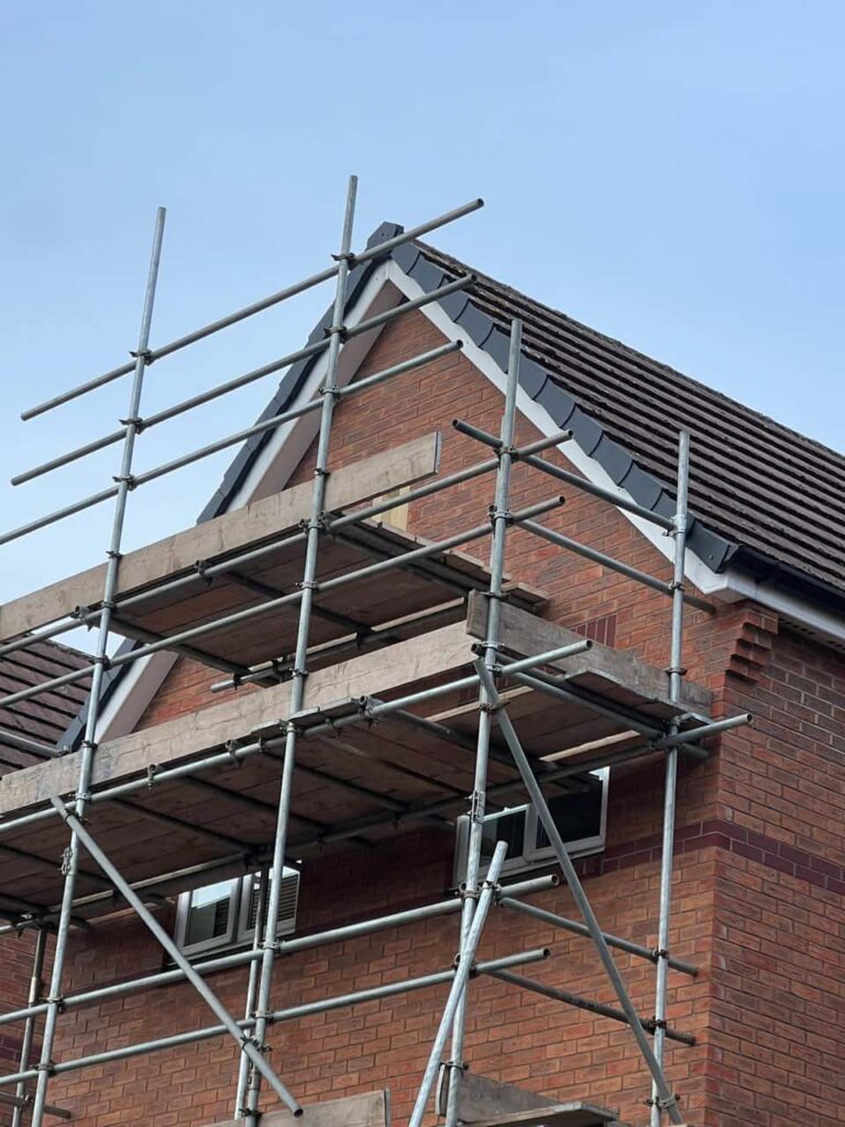 This is a photo of a roof which has just been repaired. There is a scaffold located at the gable end for access onto the roof. Works carried out by TRP Roofing Molescroft