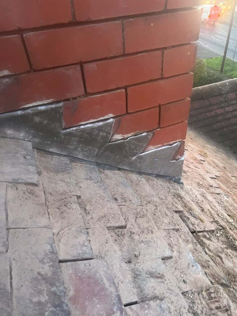 This is a photo of new leadwork being installed around an old chimney. Works carried out by TRP Roofing Molescroft